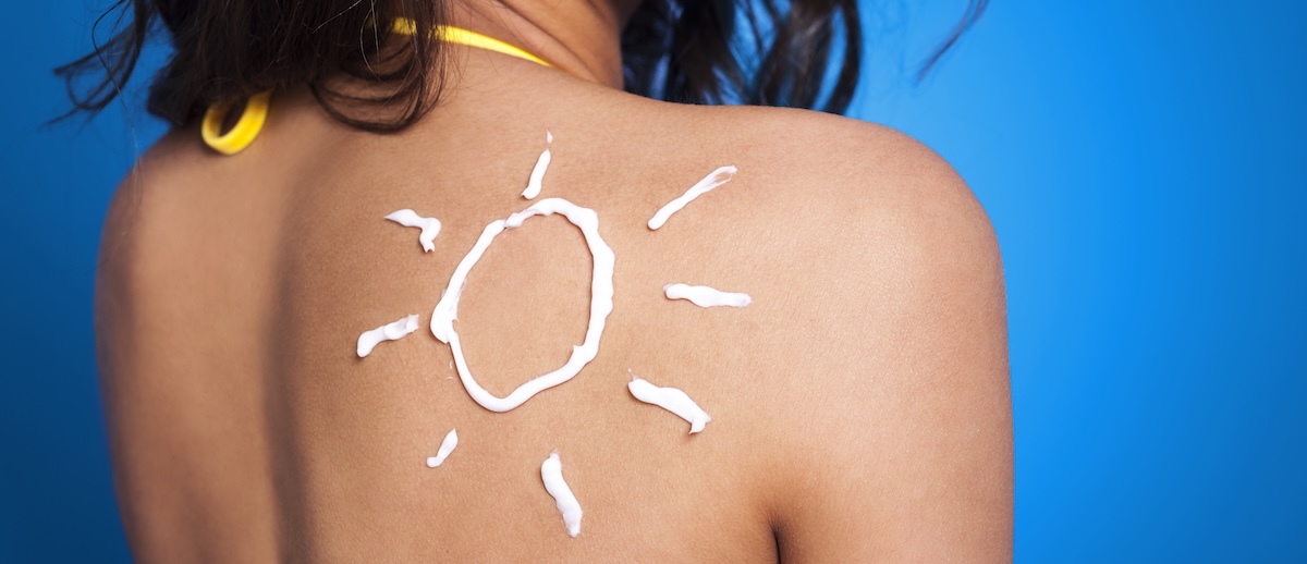 suntan lotion woman s arm sun shape
